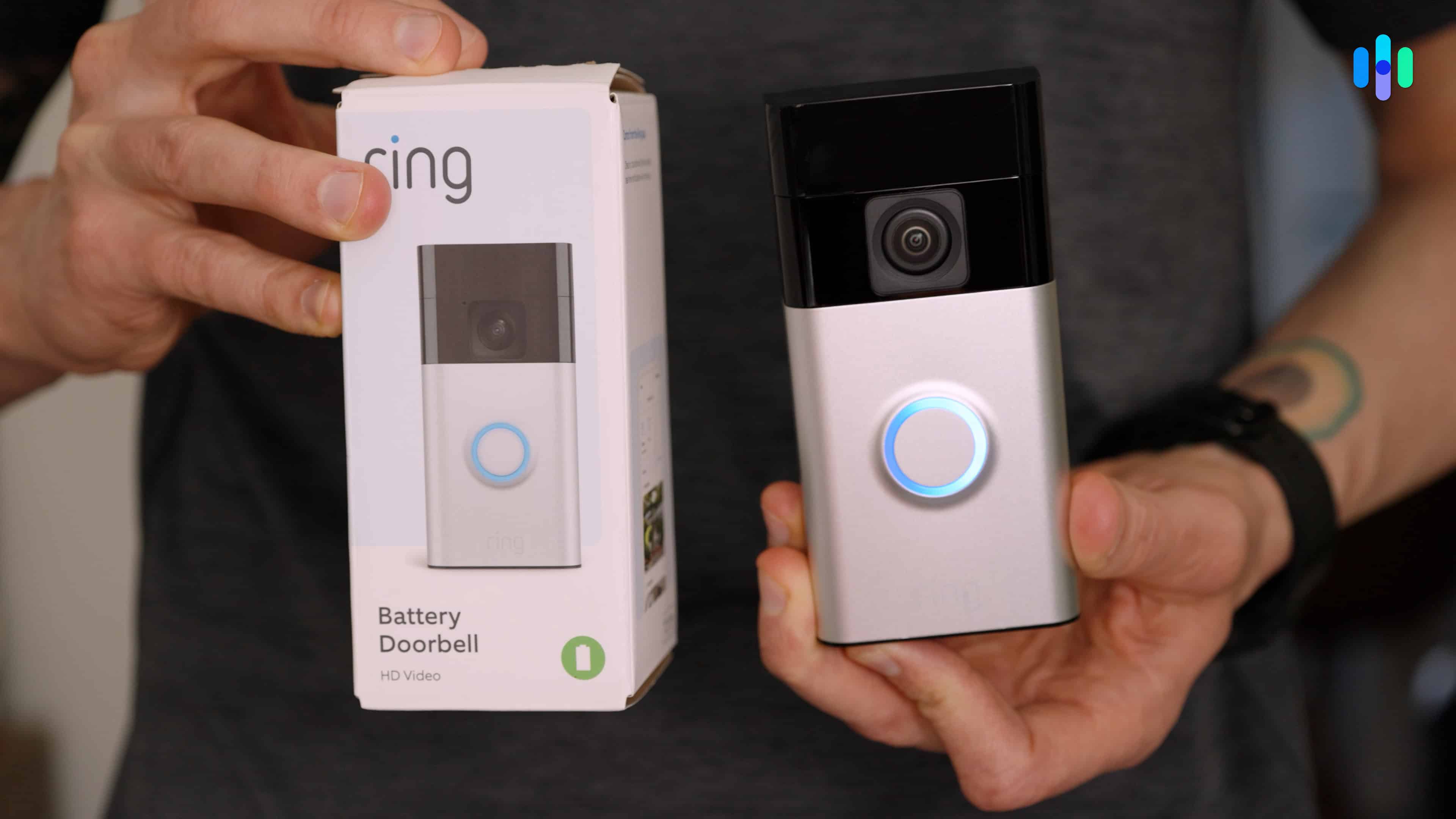 Holding the Ring Battery Doorbell and box
